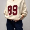 bluza z dekoltem V damska bluza damska z aplikacją bawełniana bluza z dekoltem V luźna bluza damska z aplikacją bluza z bawełny pętelkowej bluza oversize z dekoltem V modna bluza damska na co dzień bluza damska Butik Madzia Fashion