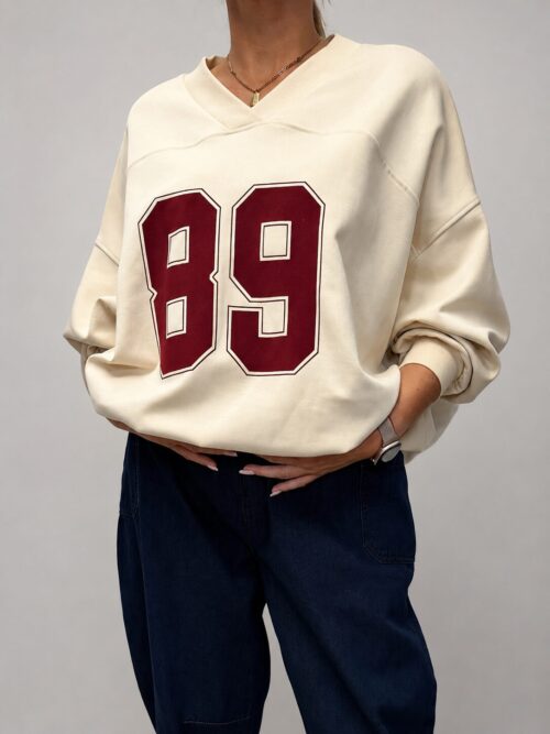 bluza z dekoltem V damska bluza damska z aplikacją bawełniana bluza z dekoltem V luźna bluza damska z aplikacją bluza z bawełny pętelkowej bluza oversize z dekoltem V modna bluza damska na co dzień bluza damska Butik Madzia Fashion
