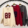 bluza z dekoltem V damska bluza damska z aplikacją bawełniana bluza z dekoltem V luźna bluza damska z aplikacją bluza z bawełny pętelkowej bluza oversize z dekoltem V modna bluza damska na co dzień bluza damska Butik Madzia Fashion