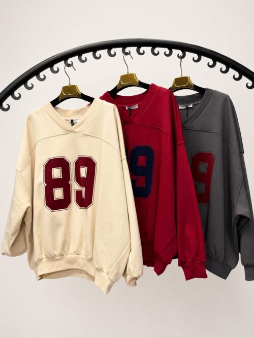 bluza z dekoltem V damska bluza damska z aplikacją bawełniana bluza z dekoltem V luźna bluza damska z aplikacją bluza z bawełny pętelkowej bluza oversize z dekoltem V modna bluza damska na co dzień bluza damska Butik Madzia Fashion